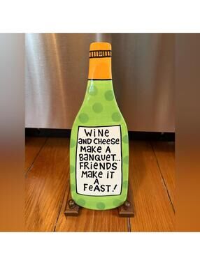 Our name is Mud Laura Veasey Ceramic wine bottle shaped platter trivet